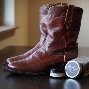 Premium Photo  Cleaning polishing restoration black leather boots